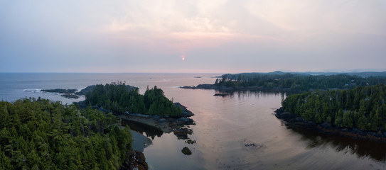 Aerial panoramic seascape view of Pacific Ocean Coast during a cloudy summer sunset. Taken in Ucluelet, Vancouver Island, BC, Canada.
