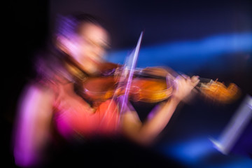 Motion blurred violonist abstract