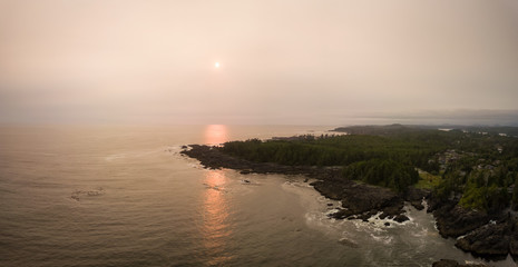 Aerial panoramic seascape view of the Pacific Ocean Coast during a cloudy summer sunset. Taken in Ucluelet, Vancouver Island, BC, Canada.