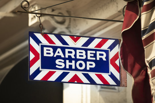 Barber shop haircut store front business sign