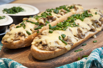 casserole with cheese and mushrooms sprinkled with fresh chive - obrazy, fototapety, plakaty