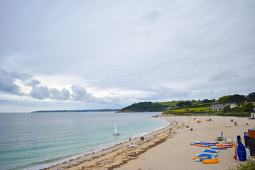 Miles long sandy beach photo taken from above. Water sports including kayaking, wind surf and body boards at a Cornish beach. Cornwall, England
