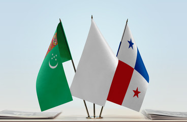Flags of Turkmenistan and Panama with a white flag in the middle