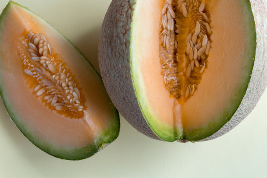 melon wedge on white background. Sweet, juicy fruit, ideal snack for healthy dieting.