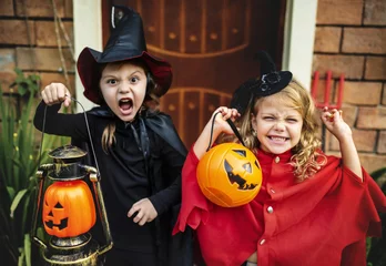 Tuinposter Little children trick or treating on Halloween © Rawpixel.com