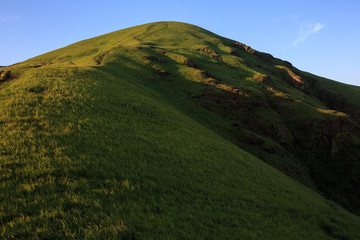 Pingxiang Wugong Mountain Scenery in Jiangxi Province, China. Lush green alpine grassland, high altitude alpine meadow. Exotic Mountains of China, Wugongshan National Park of China. Hiking, Camping