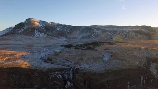 Wide aerial uav drone shot flying away from Icelandic Waterfall Glj&radic;&int;frab&radic;&int;i
