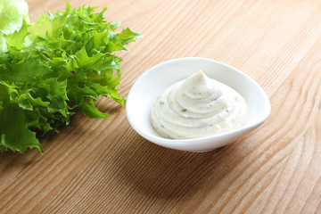 mayonnaise sauce, sour cream on a wooden background
