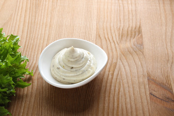 mayonnaise sauce, sour cream on a wooden background