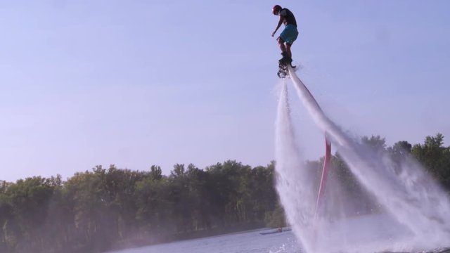 Flyboarder flying slow motion on Sky background Flyboarding video