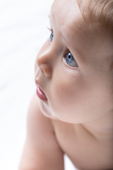 Portrait of an adorable newborn blue eyed baby