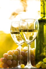 Wine Glasses With Wine Bottle And White Grape Cluster