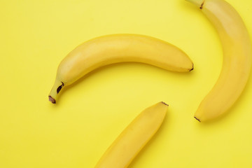 Bunch of bananas on yellow background
