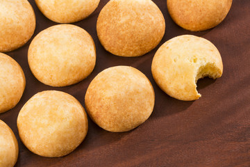 Delicious Almojabana Colombian preparation - Wooden background