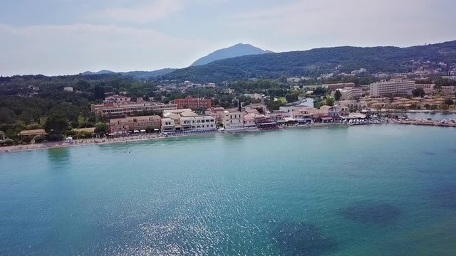 Greece, Corfu Island, drone footage of Messonghi Beach, Moraitika. Flying sideways facing the beach.