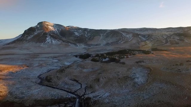 Wide aerial drone shot flying towards and over Icelandic Waterfall Glj&radic;&int;frab&radic;&int;i