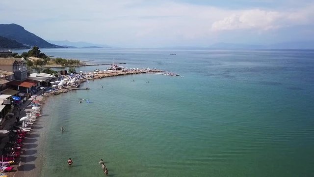Greece, Corfu Island, drone footage of Messonghi Beach, Moraitika.  Forward Flight and Rise.