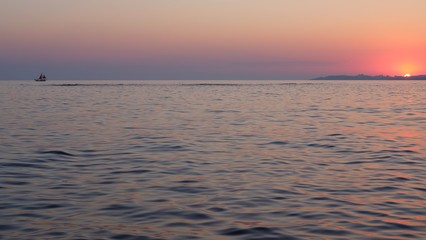 Fototapeta na wymiar sunset sea and sailboat