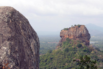 Fototapeta na wymiar Rocks and Sigiriya - The Lion Rock-, as seen from Pidurangala Rock.