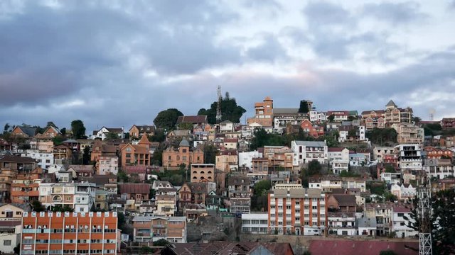 Timelapse of colourful houses on hill at sunset Antananarivo