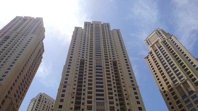 Pan Tilt Day view in the blue sky at Apartment/Office Buildings/Towers in Dubai Marina District UAE