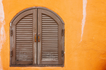 Wooden window on the concrete wall