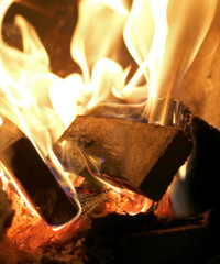 red flame quickly burning wood