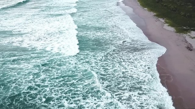Guiones Beach in Guanacaste, Costa Rica. A long beach for swimmers and surfers. Nosara is one exclusive location as is a famous location for yoga trainings and certifications.