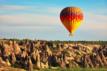 Hot air balloon in the air, popular tourist attraction in Cappadocia, Turkey
