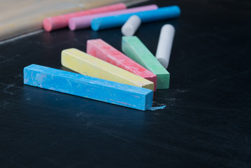 on blackboard close-up, colorful chalk for writing