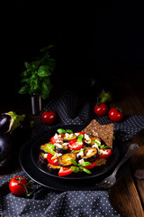 Eggplant grilled with aromatic feta cheese and tomatoes