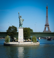 Paris, France - 08 18 2018:  Les Quais de Seine - Bateau mouche et Statue de la liberté