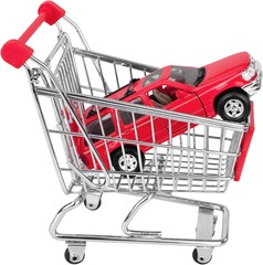 New elegant red car in shopping cart isolated on white
