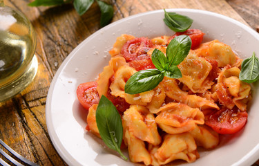 Traditional italian dish - tortellini with tomato sauce