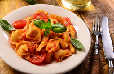 Traditional italian dish - tortellini with tomato sauce