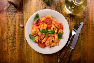 Traditional italian dish - tortellini with tomato sauce