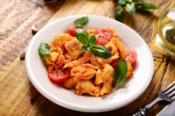 Traditional italian dish - tortellini with tomato sauce - obrazy, fototapety, plakaty