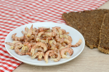 north sea crabs in the bowl  and black bread on table