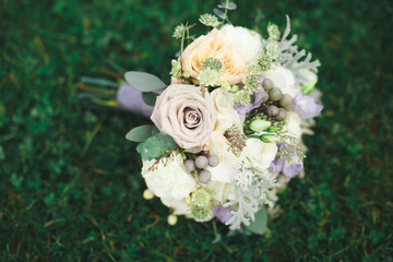 Wonderful luxury wedding bouquet of different flowers