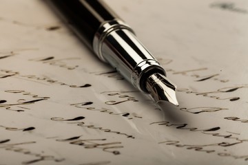 Iridium Point Fountain Pen Lying on the Letter - Close Up