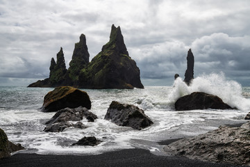 Basalt rock formations Troll toes on black beach. Reynisdrangar, Vik, Iceland