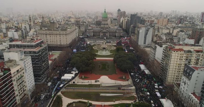 Drone view of Argentinian Congress and crowd outisde , during legal abortion vote. Steady Establishing shot.