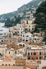 Obraz premium Amalfi coast in Italy, the most beautiful city. Streets and old architecture, narrow passages, shops and cafes. View from the sea and above
