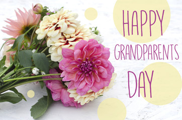 Beautiful dahlias on wooden background. Bouquet of colored dahlias. Happy grandparents day.