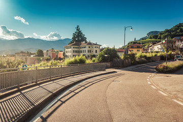 Naklejka na ściany i meble Road in italian alpine village in Trento