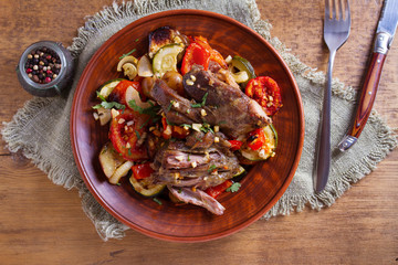 Slow cooker lamb with vegetables and garlic. View from above, top studio shot