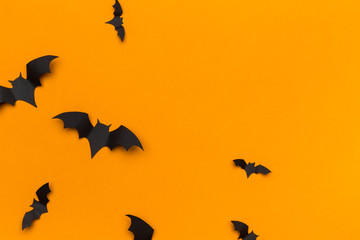 halloween and decoration concept - paper bats flying