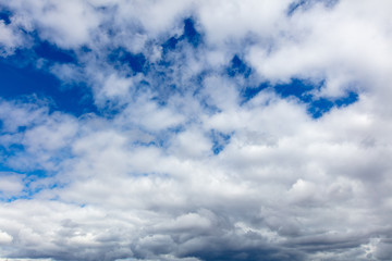 Clouds on a blue sky as a background