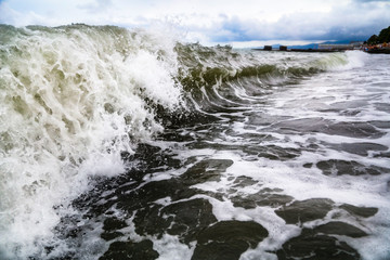 Storm waves on the seashore as a background