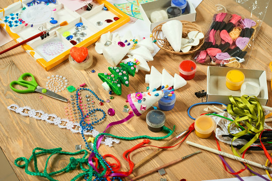 Handmade decorations for new year and other holidays. Artwork workplace with creative accessories.